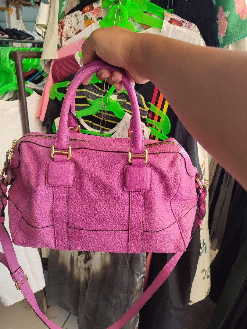 Loewe Amazona Handbag (Category: Luxury Bags & Wallets) located in Puerto Princesa. Submitted by thriftedsoulsy2k (Listing ID 1432235560, Image 1). Description: - Loewe Amazona handbag - Vibrant pink color - Top handle and detachable shoulder strap - Zip closure with gold-tone hardware - Lined interior - Made in Spain - Minor wear on corners issue pipings .