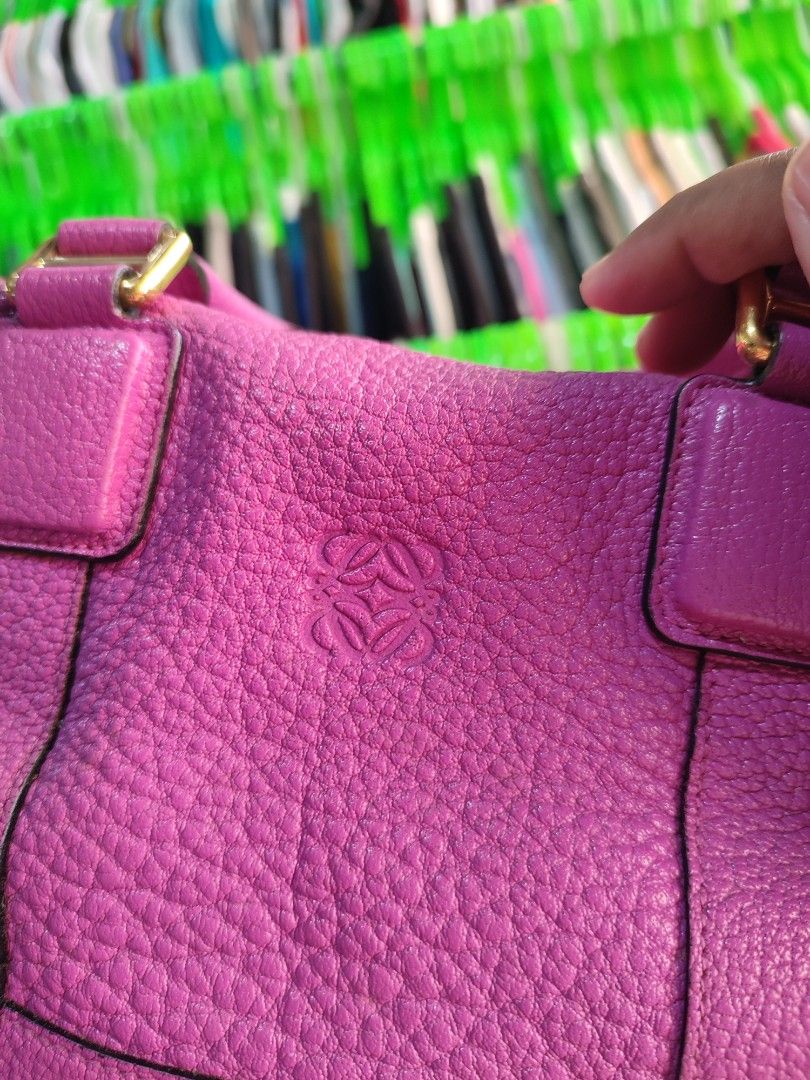 Loewe Amazona Handbag (Category: Luxury Bags & Wallets) located in Puerto Princesa. Submitted by thriftedsoulsy2k (Listing ID 1432235560, Image 3). Description: - Loewe Amazona handbag - Vibrant pink color - Top handle and detachable shoulder strap - Zip closure with gold-tone hardware - Lined interior - Made in Spain - Minor wear on corners issue pipings .