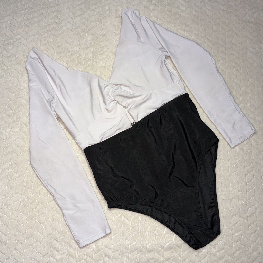 Long Sleeve Swimsuit Bodysuit (LARGE) (Category: Bikinis & Swimsuits) located in Valenzuela. Submitted by declutterwithmrll (Listing ID 1432335658, Image 1). Description: - Long-sleeved swimsuit - Bodysuit design - Colors: Gray, White, Black, Green - Zipper closure - Perfect for swimming and water activities - Comfortable and fashionable.