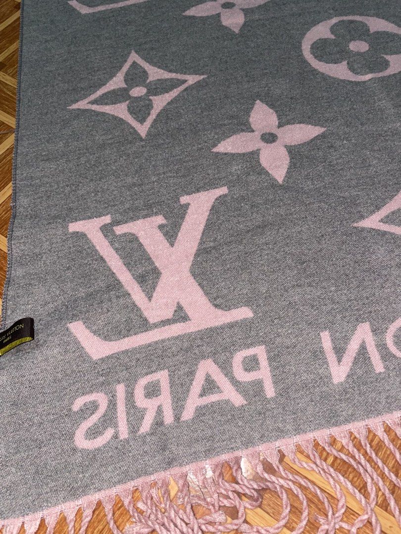 Louis Vuitton Cashmere Silk Scarf (Category: Luxury Accessories) located in Baguio. Submitted by cleverlion_e92944 (Listing ID 1432312359, Image 3). Description: Louis Vuitton scarf is made of 65% cashmere and 35% silk. It features the Louis Vuitton logo and the words "LOUIS VUITTON PARIS". The scarf has a pink and gray color scheme with fringe detailing on the edges. It is reversible, with a different color scheme on each side..