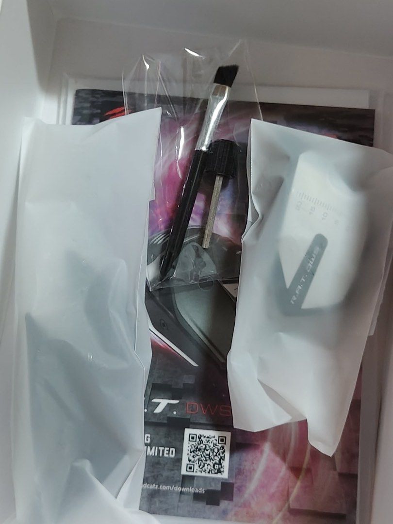 Mad Catz R.A.T. DWS Modular Gaming Mouse (Category: Mouse & Mousepads) located in Quezon City. Submitted by breezynem (Listing ID 1432219520, Image 3). Description: - Mad Catz R.A.T. DWS gaming mouse - Dual wireless connectivity - Includes: Mouse, accessories, and AA battery - Unique, adjustable design - Box with Mad Catz logo and product info.