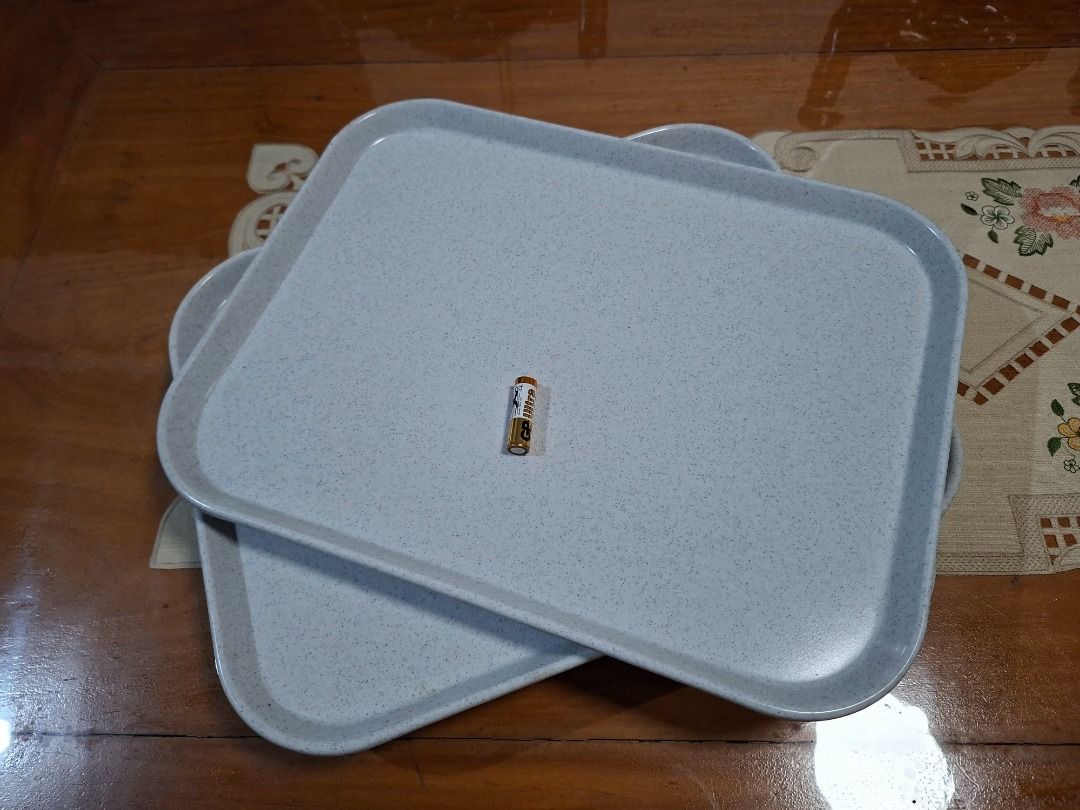 Melamine Serving Trays Set of 4 (Category: Dinnerware & Cutlery) located in Taguig. Submitted by d_man11 (Listing ID 1432218676, Image 2). Description: - Set of 4 rectangular serving trays - Light blue speckled design - Made of durable melamine - Stackable for easy storage Dimensions: 45 x 35 cm.
