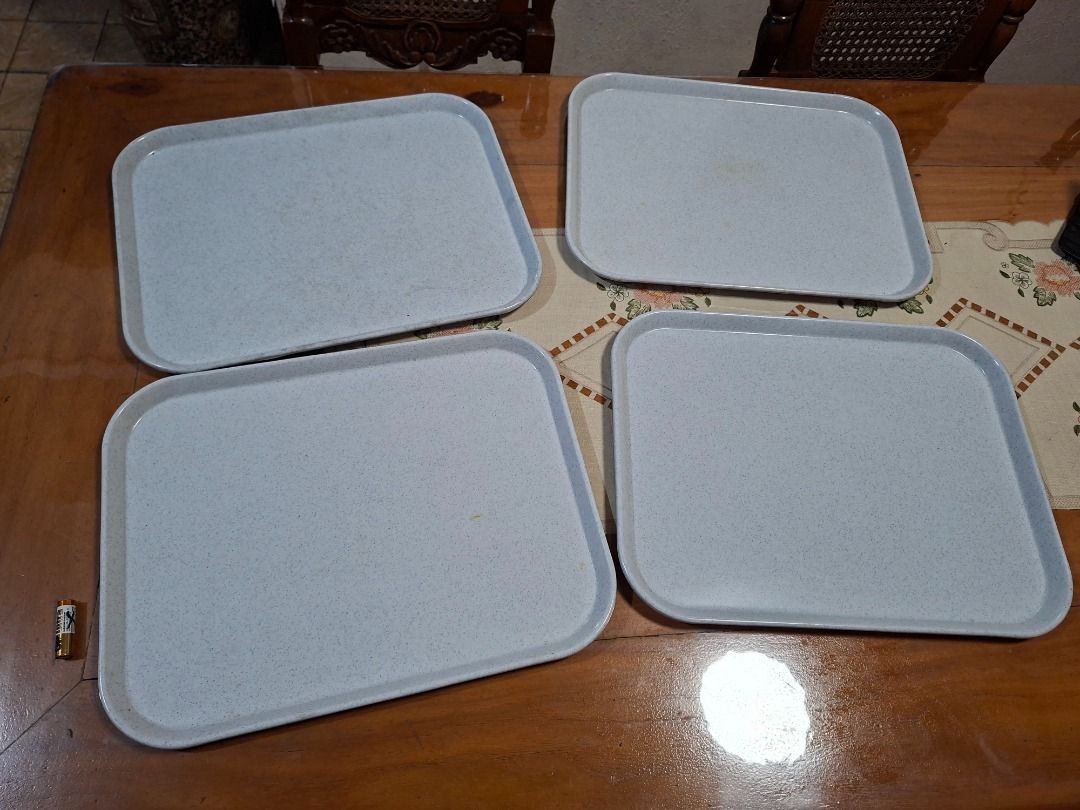 Melamine Serving Trays Set of 4 (Category: Dinnerware & Cutlery) located in Taguig. Submitted by d_man11 (Listing ID 1432218676, Image 1). Description: - Set of 4 rectangular serving trays - Light blue speckled design - Made of durable melamine - Stackable for easy storage Dimensions: 45 x 35 cm.