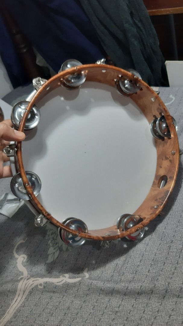 Muscell Percussion 10-inch Tambourine (Category: Musical Instruments) located in Cainta. Submitted by alpaca19 (Listing ID 1413874968, Image 1). Description: - Muscell Percussion Tambourine - 10-inch tunable design - White drumhead - Wooden frame - Metal jingles - Double row jingles - Perfect for adding percussion to your music!.
