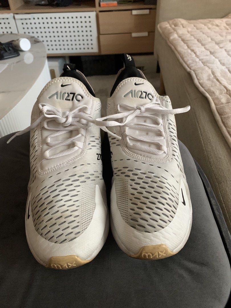 Nike Air Max 270 White Sneakers (Category: Sneakers) located in Quezon City. Submitted by rsalinda (Listing ID 1432251552, Image 1). Description: - Nike Air Max 270 - White colorway - US size 10 - Iconic Air Max bubble heel - Black Nike swoosh logo - Visible signs of wear on soles and uppers - White laces - Insole tag visible in photos.