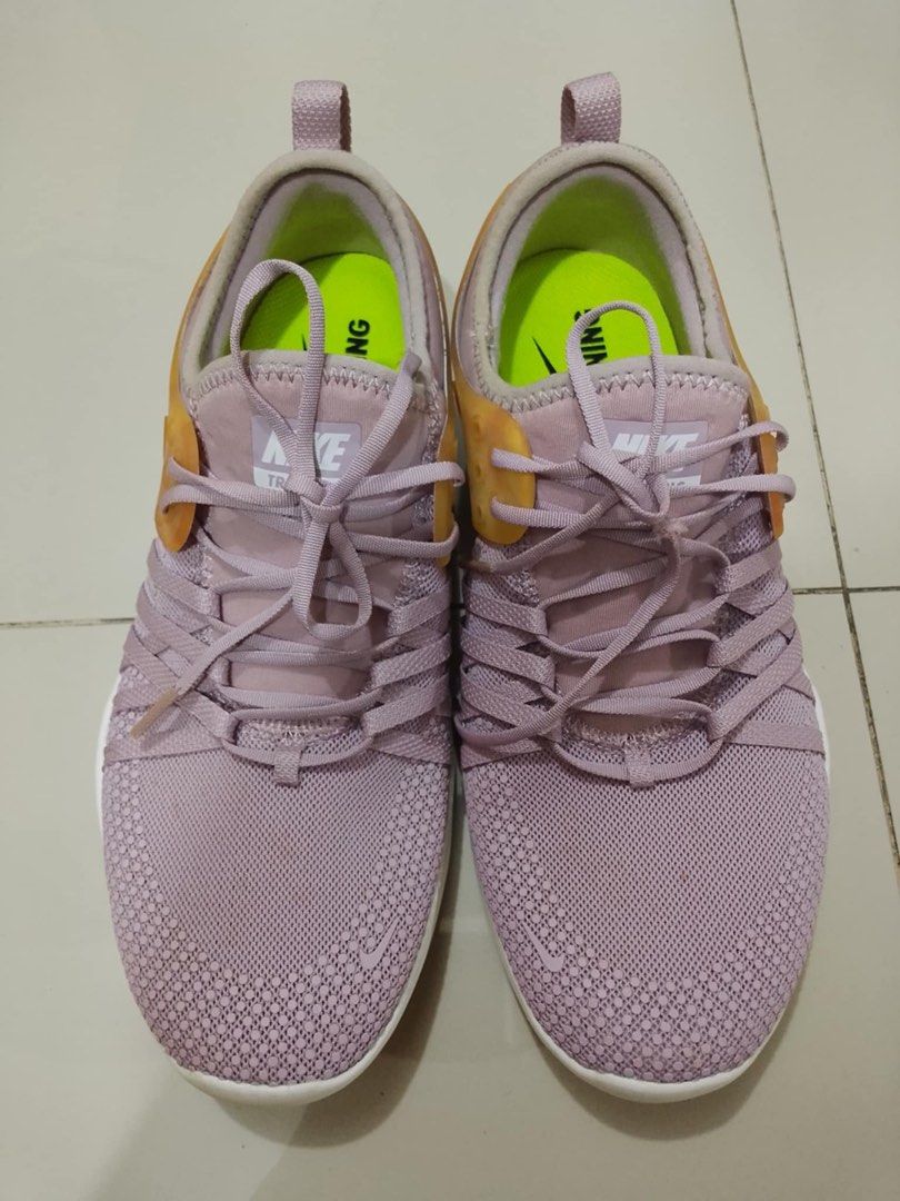 Nike Training Shoes (Category: Sneakers) located in Manila. Submitted by usbrandedcollections (Listing ID 1432201264, Image 1). Description: Onhand ready to ship! Lahat Original Expected minor flaws / stain ❌ NO Refund, swap, return & exchange Color may vary due to lightning - Lavender upper with white sole - Lace-up closure - Heel pull tab - Nike logo on the side - Bright green insole - Designed for training - Flexible sole.
