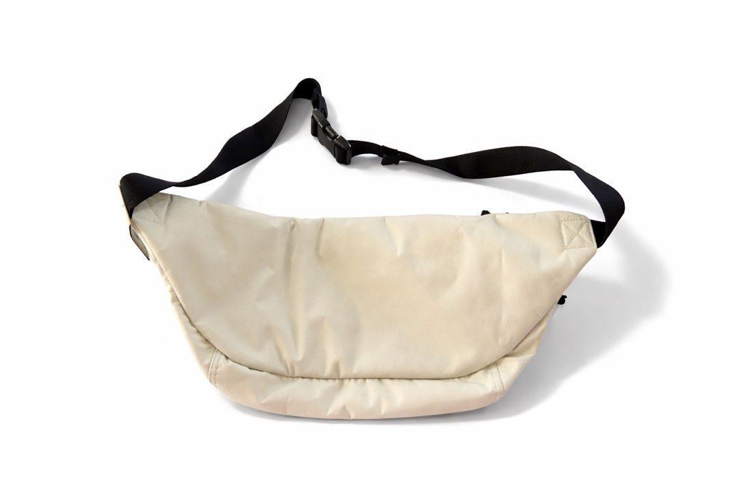 Nike Waist Bag UNISEX (Category: Belt bags, Clutches and Pouches) located in Antipolo. Submitted by cl026 (Listing ID 1432209053, Image 2). Description: - Cream-colored Nike waist bag - Black adjustable strap - Zippered main compartment - Nike logo on the front - Unisex - Capacity: 610 CU IN - Suggested retail price: "$40".
