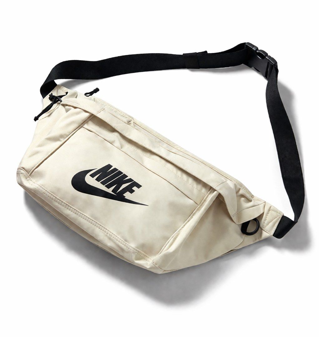 Nike Waist Bag UNISEX (Category: Belt bags, Clutches and Pouches) located in Antipolo. Submitted by cl026 (Listing ID 1432209053, Image 1). Description: - Cream-colored Nike waist bag - Black adjustable strap - Zippered main compartment - Nike logo on the front - Unisex - Capacity: 610 CU IN - Suggested retail price: "$40".