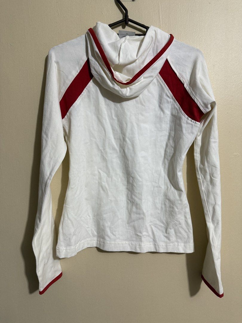 Nike White and Red Hoodie (Category: Coats, Jackets and Outerwear) located in Quezon City. Submitted by lau_v (Listing ID 1432377086, Image 2). Description: - White Nike hoodie with red accents - Features Nike logo - Hooded with long sleeves - Red cuffs - Size: M on tag but fits S (body hugging) With stain shown on photo.