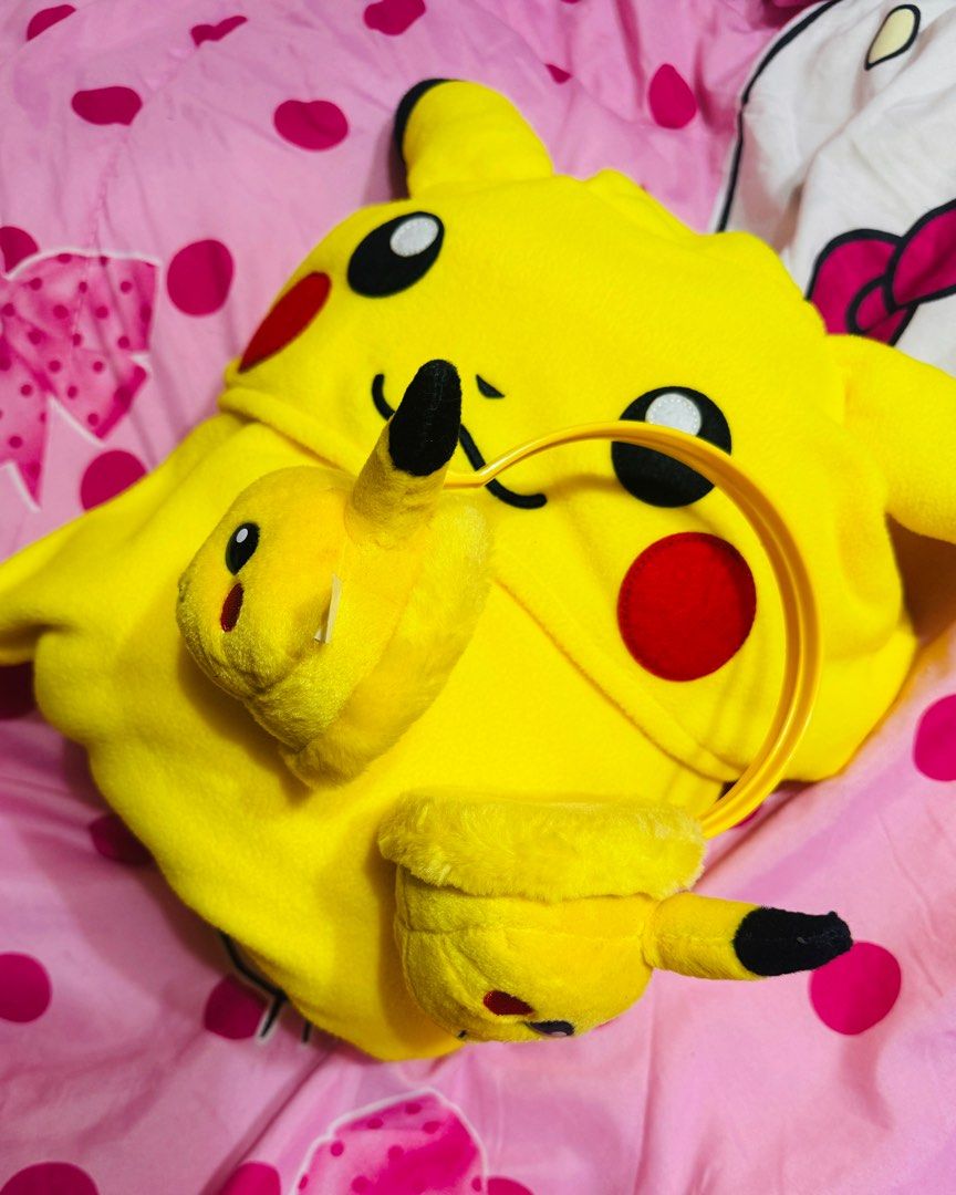 Pokemon Pikachu Onesie with Earmuffs (Category: Babies & Kids Fashion) located in Lipa City. Submitted by twinklexpress (Listing ID 1432240806, Image 2). Description: - Adorable Adult Pikachu onesie! - Includes matching yellow earmuffs. - Onesie features Pikachu's face on the hood. - Button-down front for easy wear. - Earmuffs also have Pikachu's face. - Perfect for Pokemon enthusiasts!.