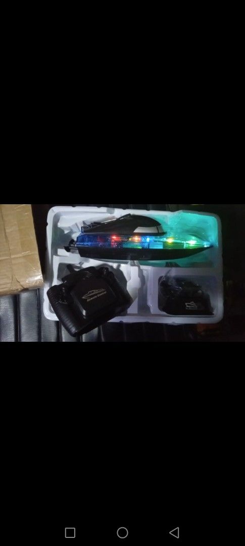 Remote Control speed Boat (Category: Remote Control Toys) located in Manila. Submitted by jackmdcm (Listing ID 1432292955, Image 1). Description: - Sleek remote control boat - Stylish blue and black design - Comes with remote control, battery, and charger - Equipped with LED lights - Sports Game model - Ready to use! Loc tatalon qc .