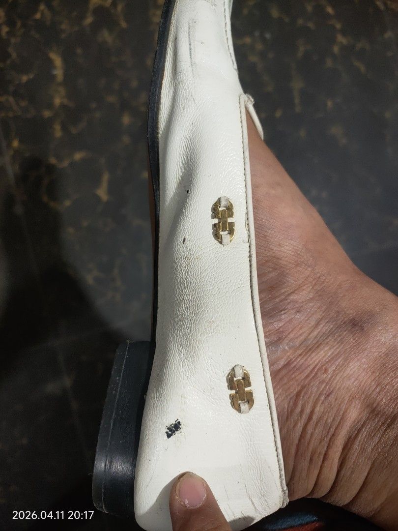 Salvatore Ferragamo White Loafers (Category: Loafers) located in Cauayan City . Submitted by soloparentshop (Listing ID 1432254705, Image 2). Description: - Salvatore Ferragamo loafers - Slip-on design - Features gold-colored hardware with brand logo - Shows visible wear and tear on leather - Classic style.