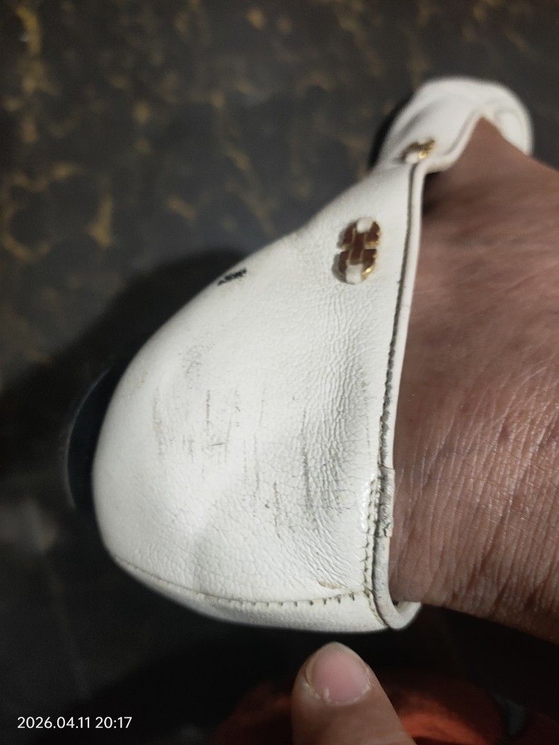 Salvatore Ferragamo White Loafers (Category: Loafers) located in Cauayan City . Submitted by soloparentshop (Listing ID 1432254705, Image 3). Description: - Salvatore Ferragamo loafers - Slip-on design - Features gold-colored hardware with brand logo - Shows visible wear and tear on leather - Classic style.