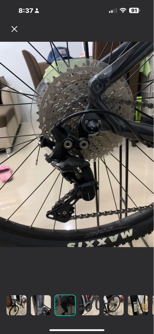 Shimano XT Rear Derailleur (Category: Bicycles) located in Rizal. Submitted by 007er (Listing ID 1432199976, Image 1). Description: Merida Big Nine 500 - Shimano XT rear derailleur - Includes derailleur, chain, and cassette - Black bike frame - Features Maxxis tire - Cassette with multiple gears - Rear wheel mounted.