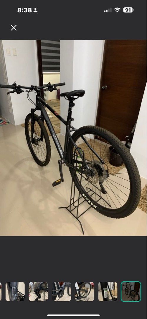 Shimano XT Rear Derailleur (Category: Bicycles) located in Rizal. Submitted by 007er (Listing ID 1432199976, Image 2). Description: Merida Big Nine 500 - Shimano XT rear derailleur - Includes derailleur, chain, and cassette - Black bike frame - Features Maxxis tire - Cassette with multiple gears - Rear wheel mounted.