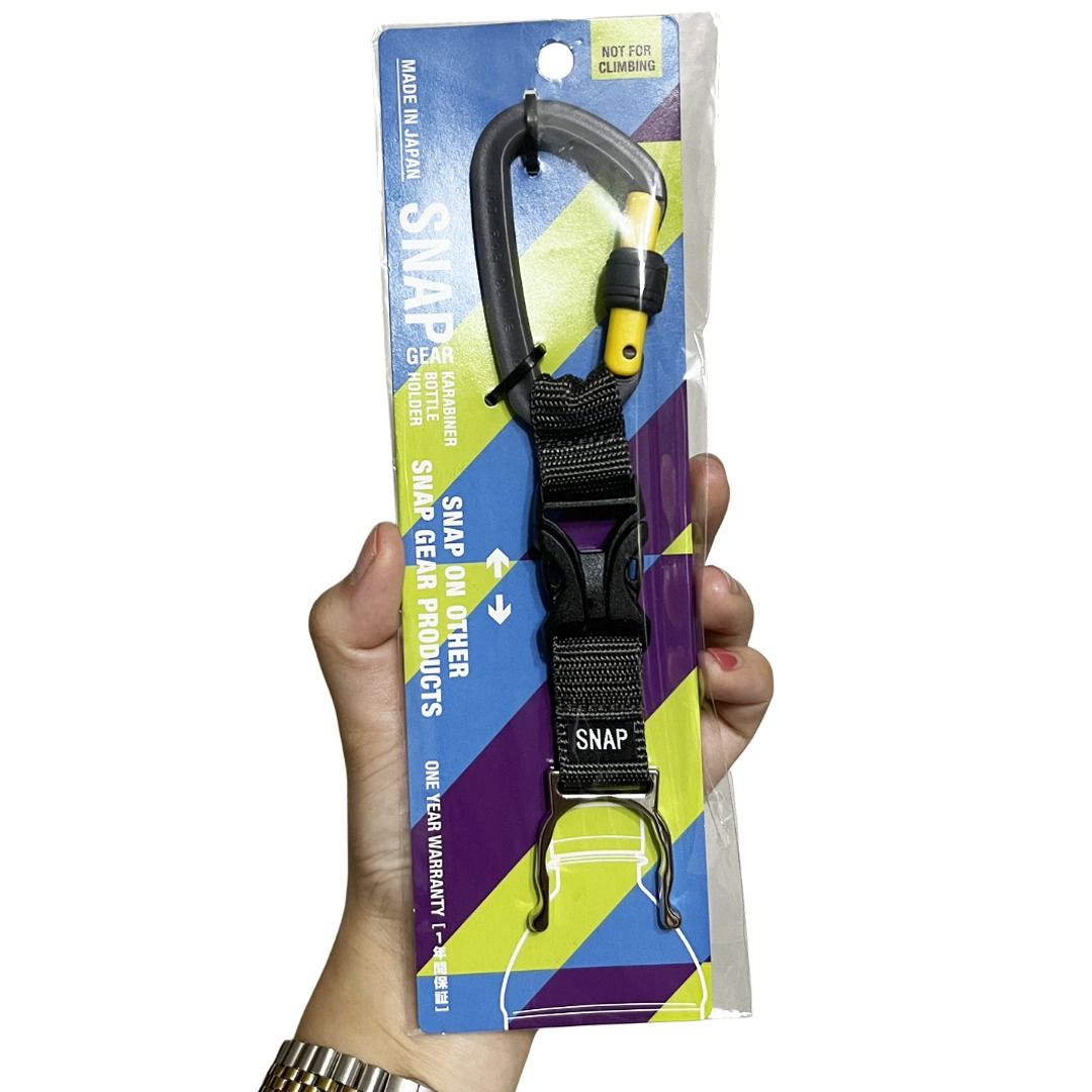 SNAPGEAR Carabiner Bottle Holder (Category: Everything Else Others) located in Quezon City. Submitted by declutter_to_downsize (Listing ID 1432355748, Image 2). Description: Brand: Snapgear Purpose: Securely holds plastic bottles for easy carrying on bags or belts. Design: Features a carabiner clip and a detachable strap, designed for modular use with other Snapgear products. Price is firm..