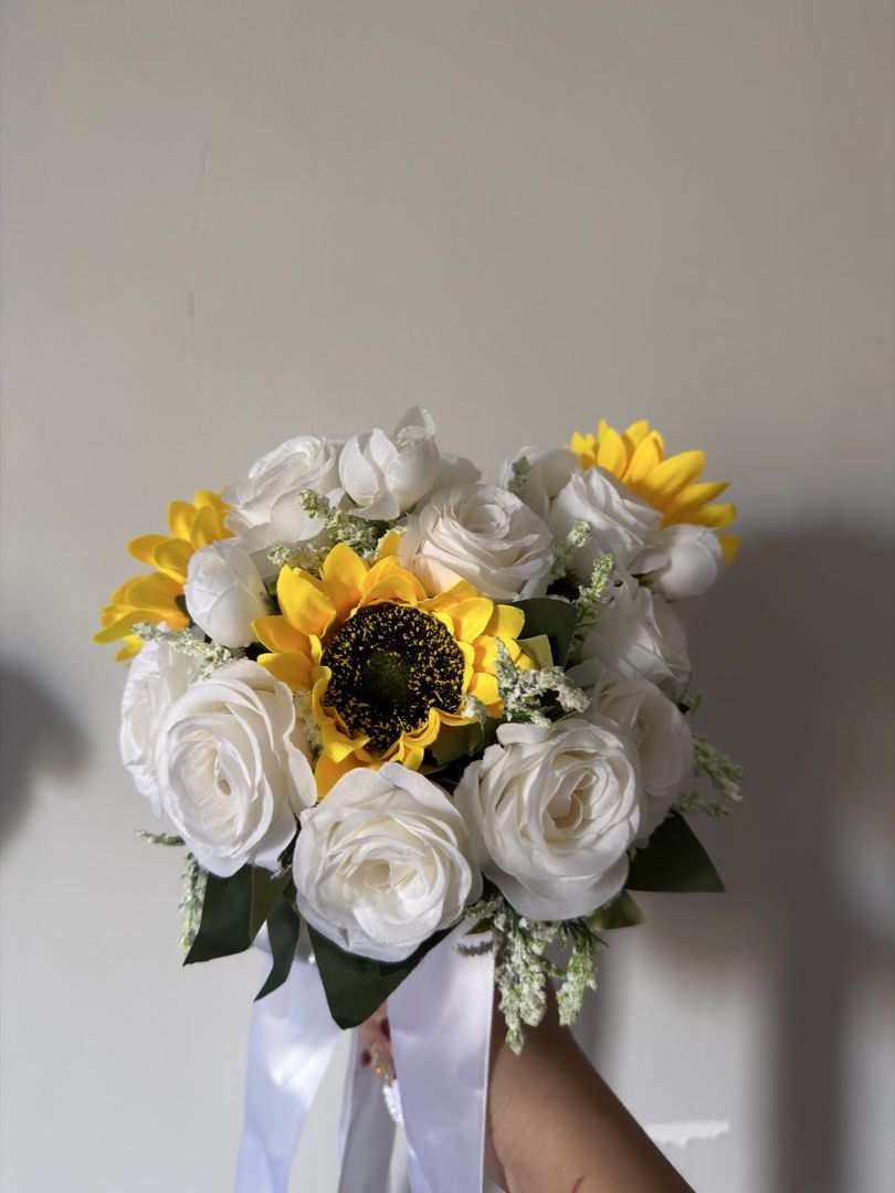 Sunflower and White Rose Bouquet (Category: Flowers & Bouquets) located in Quezon City. Submitted by panniespicks (Listing ID 1432306380, Image 1). Description: - Beautiful bouquet with sunflowers and white roses. - Tied with a delicate white ribbon. - Perfect for any occasion. - Fresh and vibrant flowers. - Elegant design..