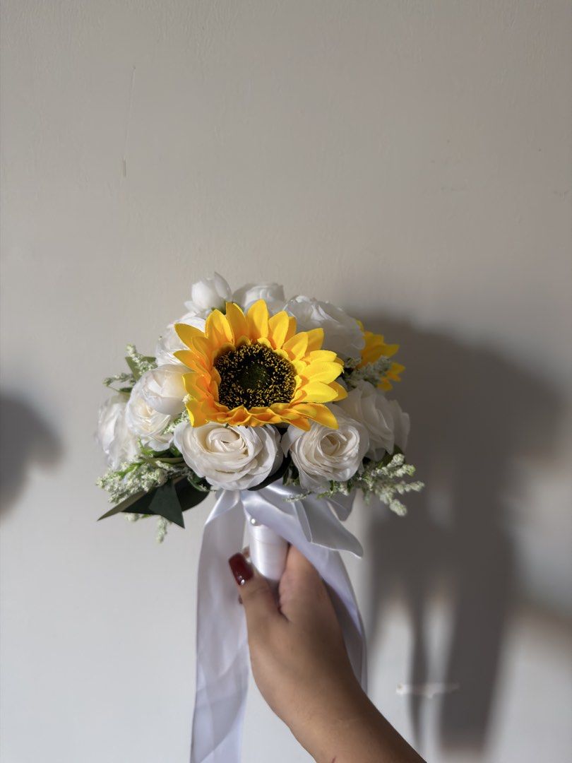 Sunflower and White Rose Bouquet (Category: Flowers & Bouquets) located in Quezon City. Submitted by panniespicks (Listing ID 1432306380, Image 2). Description: - Beautiful bouquet with sunflowers and white roses. - Tied with a delicate white ribbon. - Perfect for any occasion. - Fresh and vibrant flowers. - Elegant design..