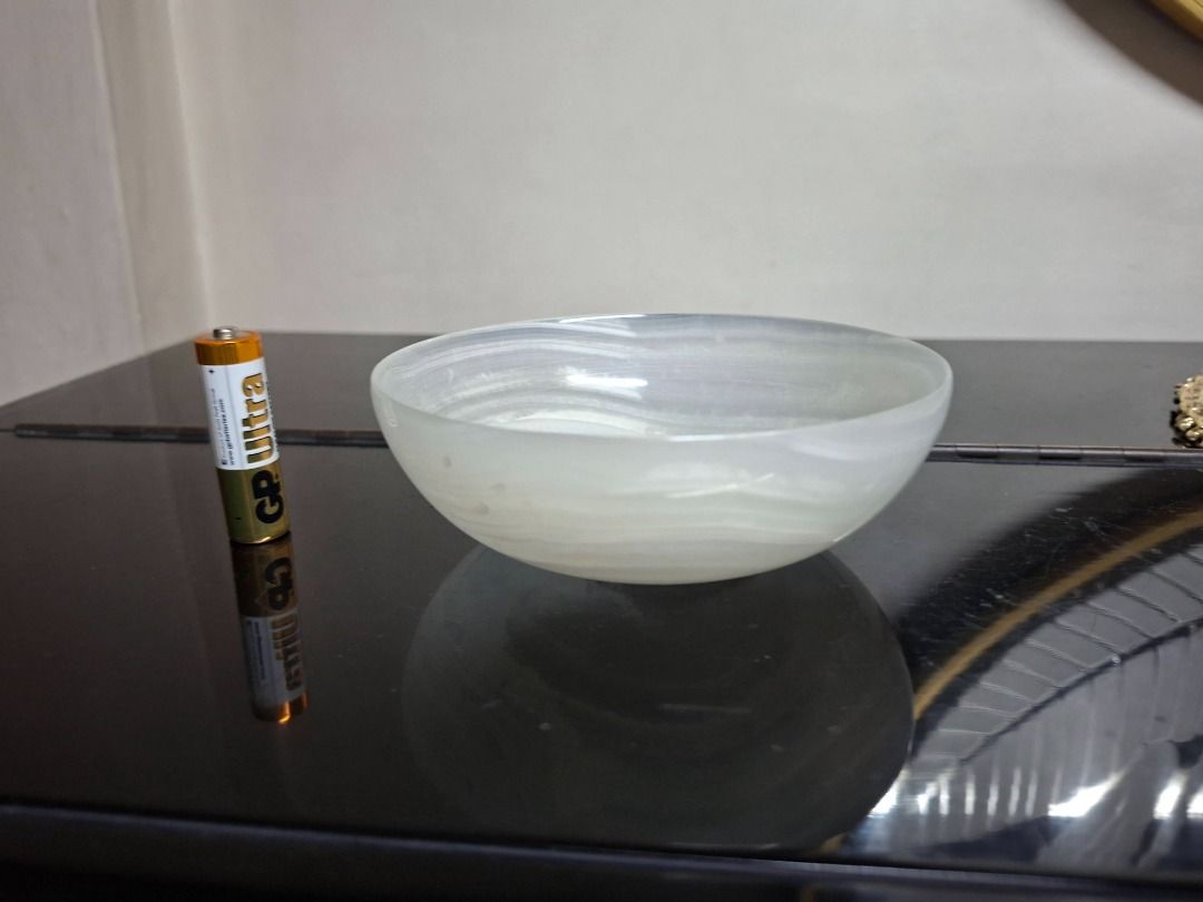 Swirled Glass Bowl (Category: Other Kitchenware & Tableware) located in Taguig. Submitted by d_man11 (Listing ID 1432256051, Image 1). Description: - Elegant glass bowl - Unique swirled design - Smooth, glossy finish - Translucent material - Round shape with flared rim - Ideal for decoration, catch all bowl, or for serving .