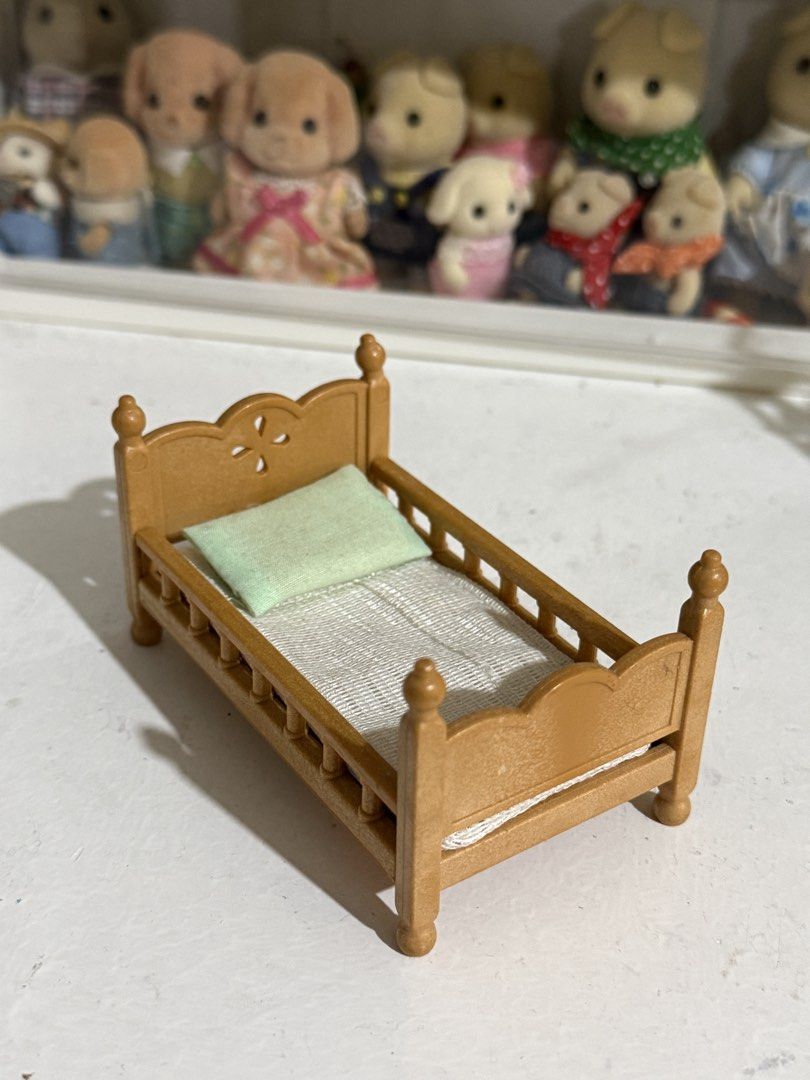 Sylvanian Families Wood Design Brown Bed Miniature House Furniture Accessory w/ pillow & cushion (Category: Kids Toys) located in Antipolo. Submitted by kiksy.closet (Listing ID 1432294955, Image 1). Description: - one edge is slightly broken + w scratches as seen on pics - check pics to evaluate condition.