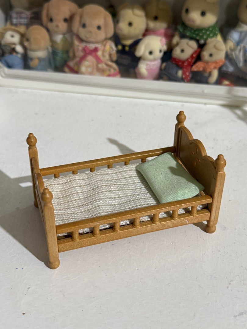 Sylvanian Families Wood Design Brown Bed Miniature House Furniture Accessory w/ pillow & cushion (Category: Kids Toys) located in Antipolo. Submitted by kiksy.closet (Listing ID 1432294955, Image 2). Description: - one edge is slightly broken + w scratches as seen on pics - check pics to evaluate condition.