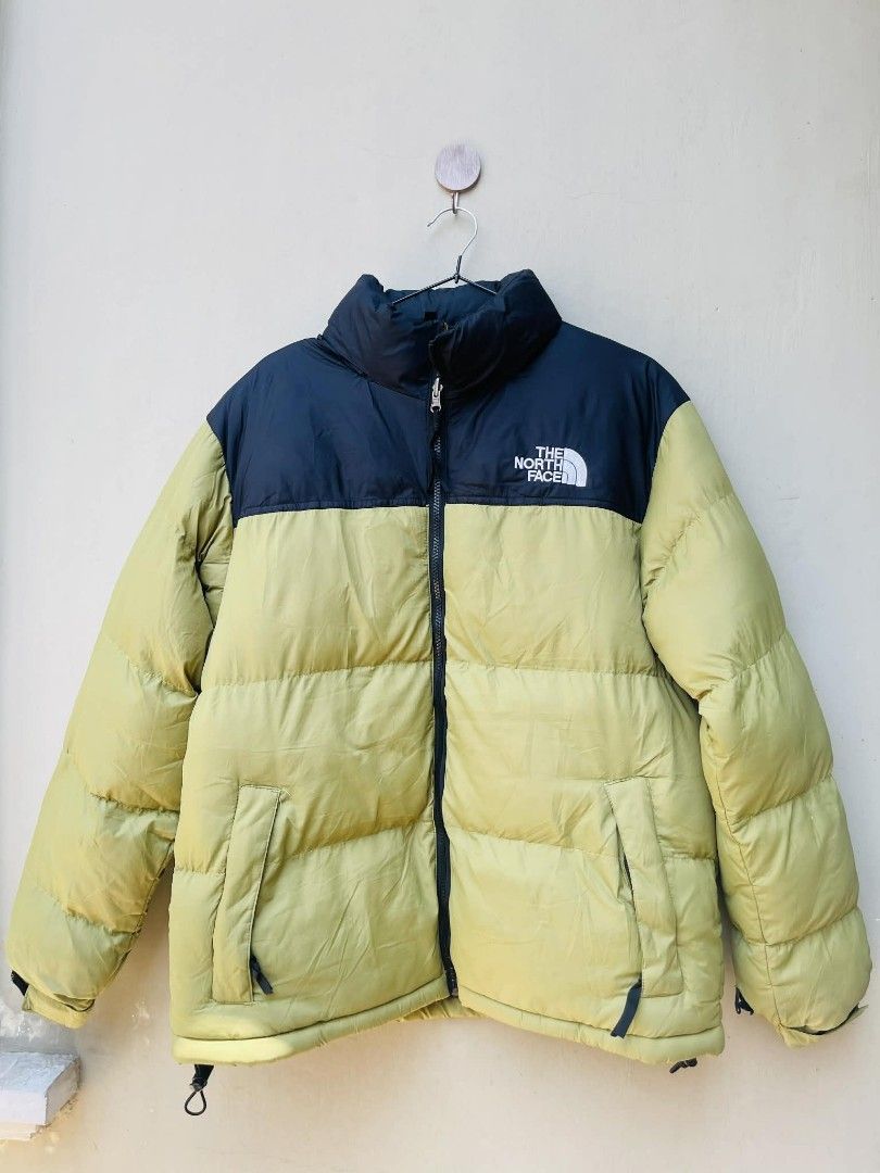The North Face Puffer Jacket (Category: Coats, Jackets and Outerwear) located in Bulacan. Submitted by fenph2021 (Listing ID 1432248493, Image 1). Description: - The North Face Puffer Jacket - Two-tone design: Black upper, Light Green lower - Full-length zipper ykk - Two side pockets - Adjustable cuffs - The North Face logo on chest and inside - Well-padded for warmth no flaw like new ykk zipper m for men l -xl for women last price posted orig.