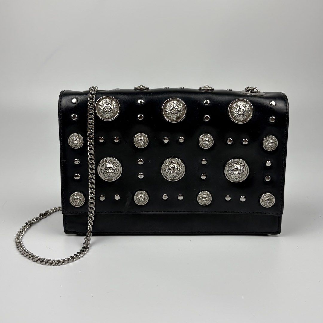 Versace - Versus Studded Chain Sling Bag (Category: Luxury Bags & Wallets) located in Bacolod City. Submitted by caast.archives (Listing ID 1432375349, Image 1). Description: Versace - Versus Studded Chain Sling Bag Authentic Size: Medium Condition: Very good Flaw: Dirt on leather (see last pic).