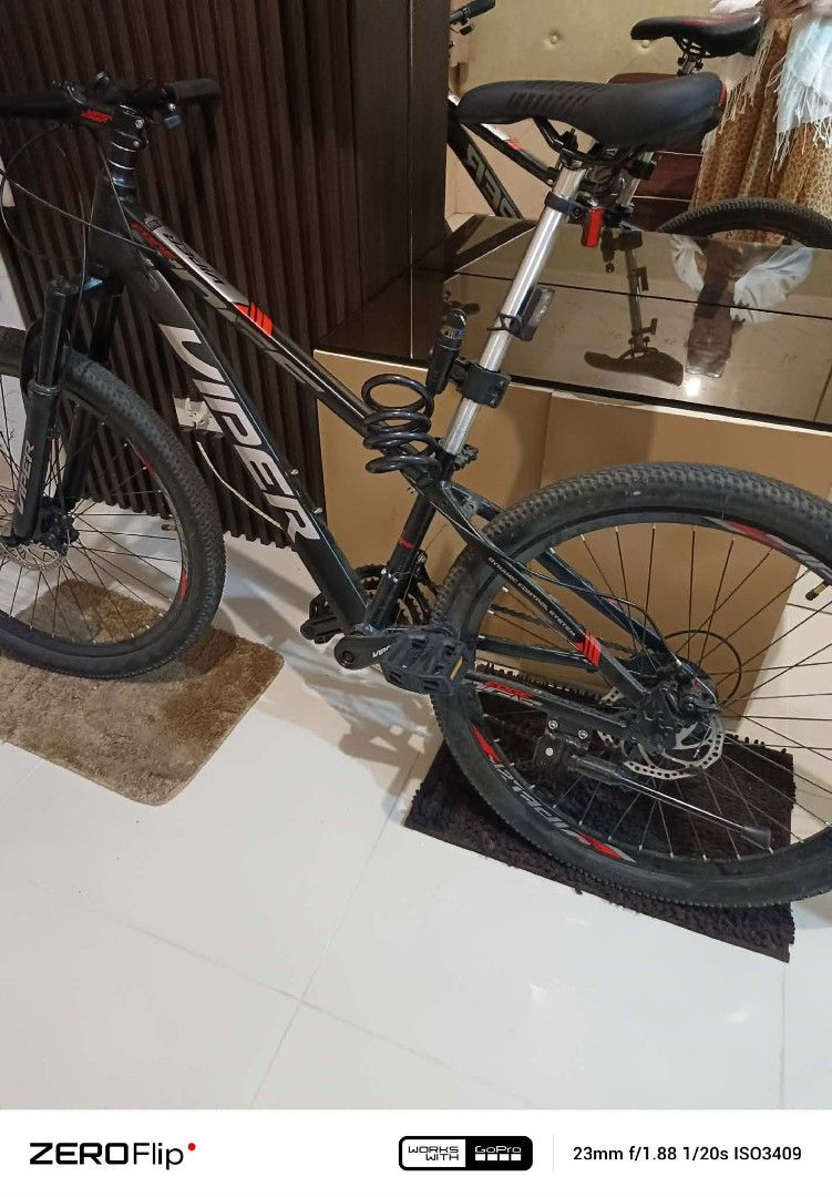 Viper Mountain Bike (Category: Bicycles) located in Manila. Submitted by armiemb1974 (Listing ID 1432267319, Image 2). Description: - Black Viper mountain bike - Features front suspension and disc brakes - Comfortable saddle - Includes bike lock - Tires with good tread for various terrains - Sporty look with red accents on frame and wheels ......