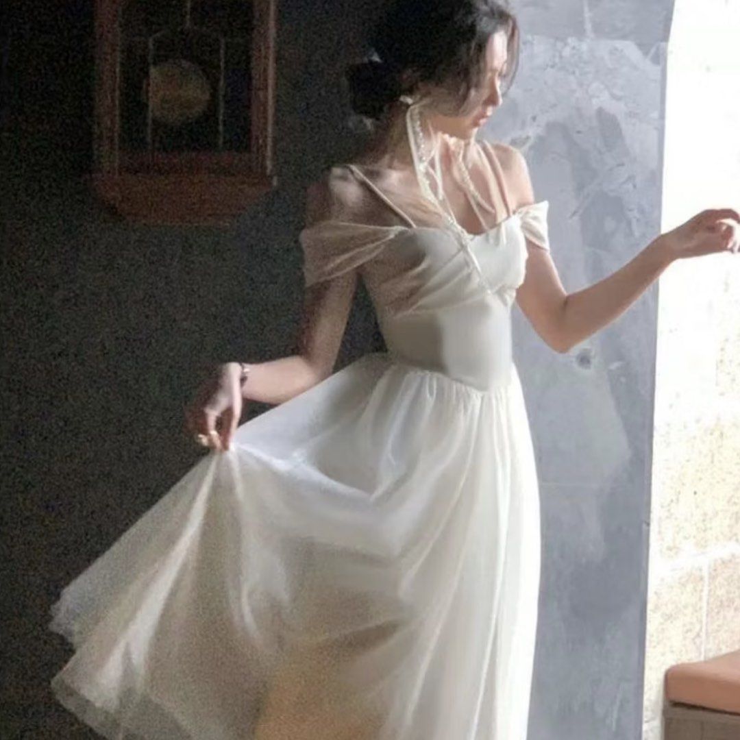 White Off-Shoulder Midi Dress (Category: Dresses) located in San Juan City. Submitted by mrivida (Listing ID 1432260260, Image 2). Description: - White off-shoulder midi dress - Used it for graduation - Fitted - Flowing skirt - Ideal for special occasions and formal events (Graduation) - Made of lightweight fabric for a comfortable fit No copyright infringement intended for the picture — credits to the rightful owner..