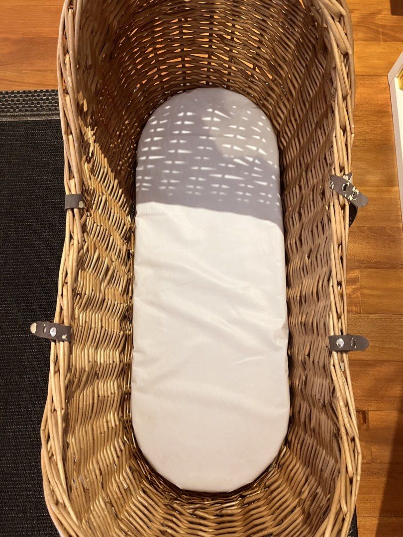 Wicker Bassinet with Wooden Stand (Category: Cots & Cribs) located in Paranaque City. Submitted by threadup (Listing ID 1432031066, Image 3). Description: - Wicker bassinet with woven design - Sturdy wooden rocking stand - Good condition. - Used less than 5 times then placed in storage. - Features leather straps but already peeling - Ideal for newborns .