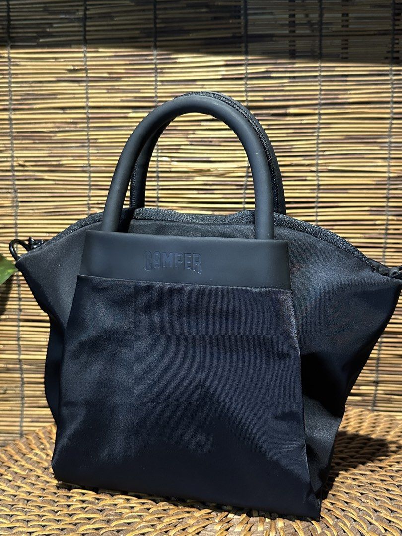 🇯🇵 CAMPER. Nylon Bag. Small Bag (Category: Luxury Bags & Wallets) located in Quezon City. Submitted by whatsinmyclosett (Listing ID 1432582475, Image 2). Description: 🇯🇵 CAMPER. Nylon Bag ☑️ITEM IN JAPAN ☑️VINTAGE ☑️100% ORIGINAL ☑️good condition ☑️ 17.5 X 27 X 20 CM ☑️manage your EXPECTATIONS this is second hand / vintage bag HINDI po BRANDNEW Binibili mo 🔴 normal sign of ussage maganda ang item! Missing strap. Kasya promax. Expensive ang b