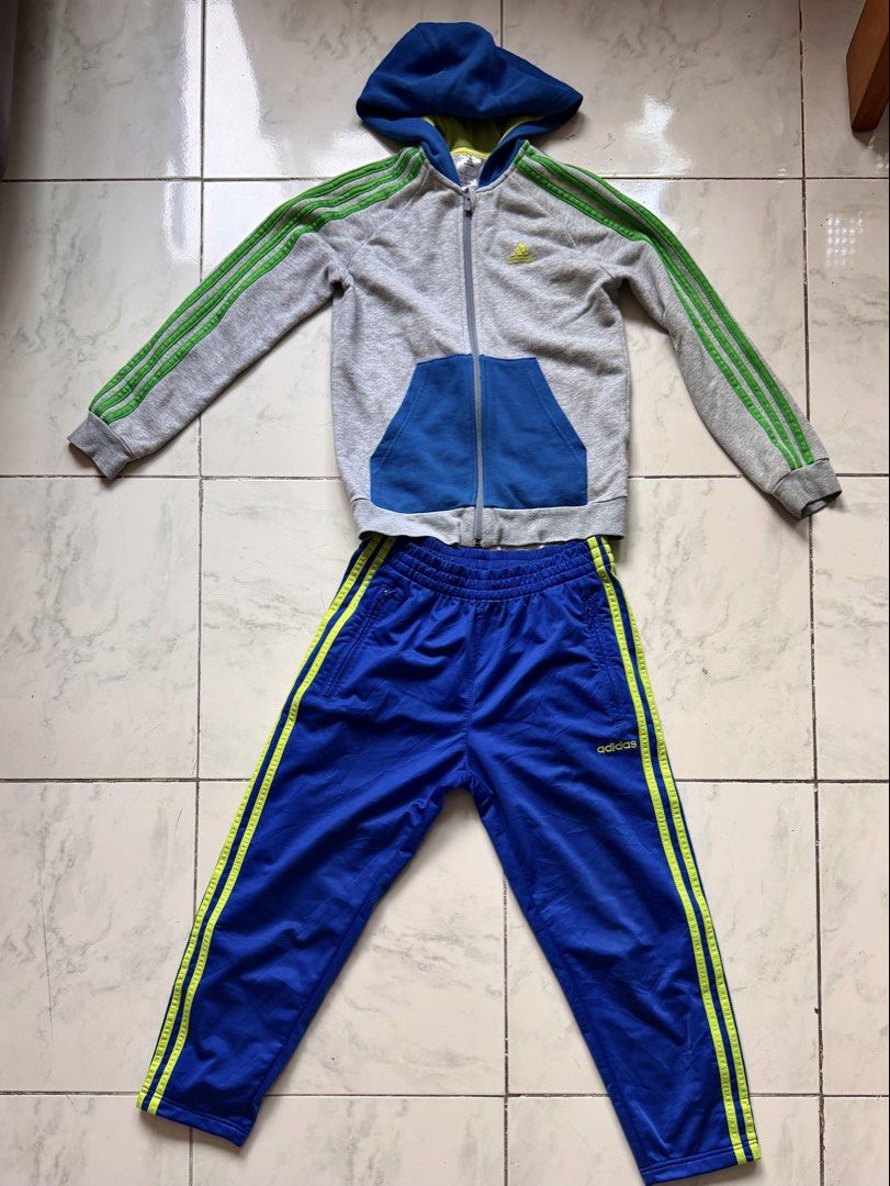 Adidas Tracksuit Set - Grey and Blue (Category: Sets & Coordinates) located in Paranaque City. Submitted by crew08 (Listing ID 1432545524, Image 2). Description: - Adidas tracksuit set (SOLD AS SET) -Size 140 - Grey zip-up hoodie - Green stripes on sleeves - Blue hood - Matching blue track pants - Green stripes on sides - Snap closures - Adidas logo on jacket and pants Good condition,zipper and buttons smoothly working -Name stamp of my son at th