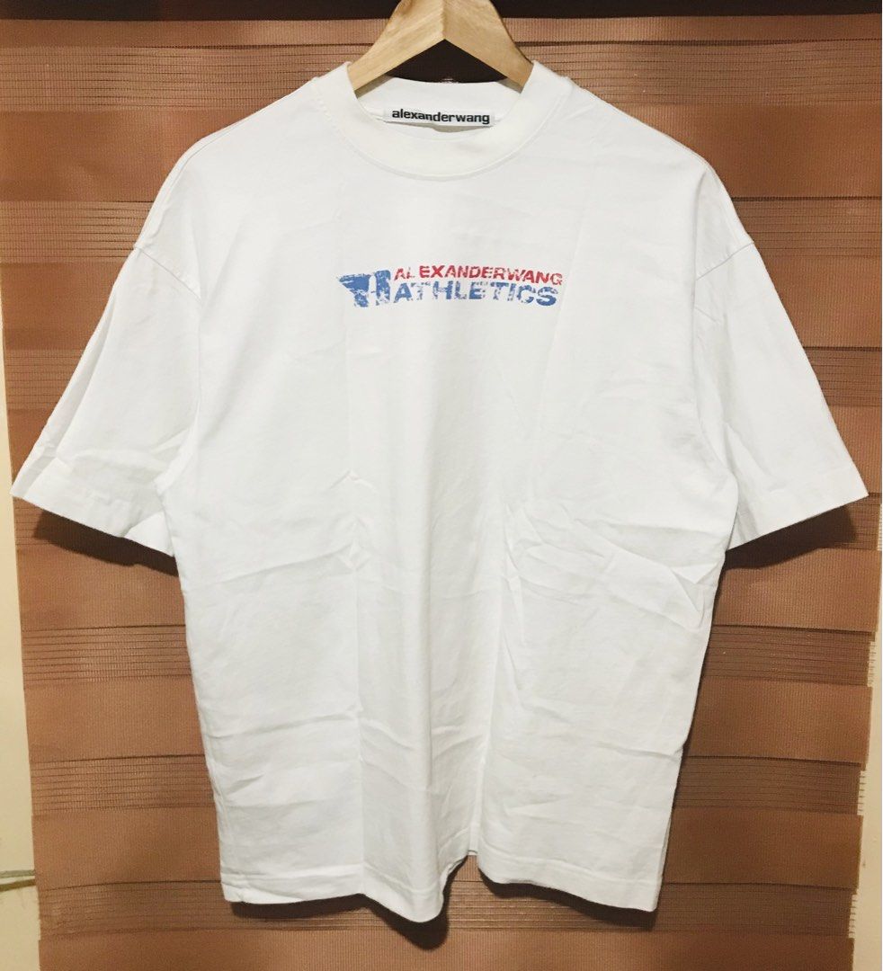 Alexander Wang Athletics T-shirt (Category: Luxury Apparel) located in Rizal. Submitted by drthriftfour (Listing ID 1432411713, Image 2). Description: - Alexander Wang Athletics T-shirt - Size: M - Features a crew neck - Brand logo on the front - Length: Approximately 26 inches - Material: Cotton - Original retail price: $265.