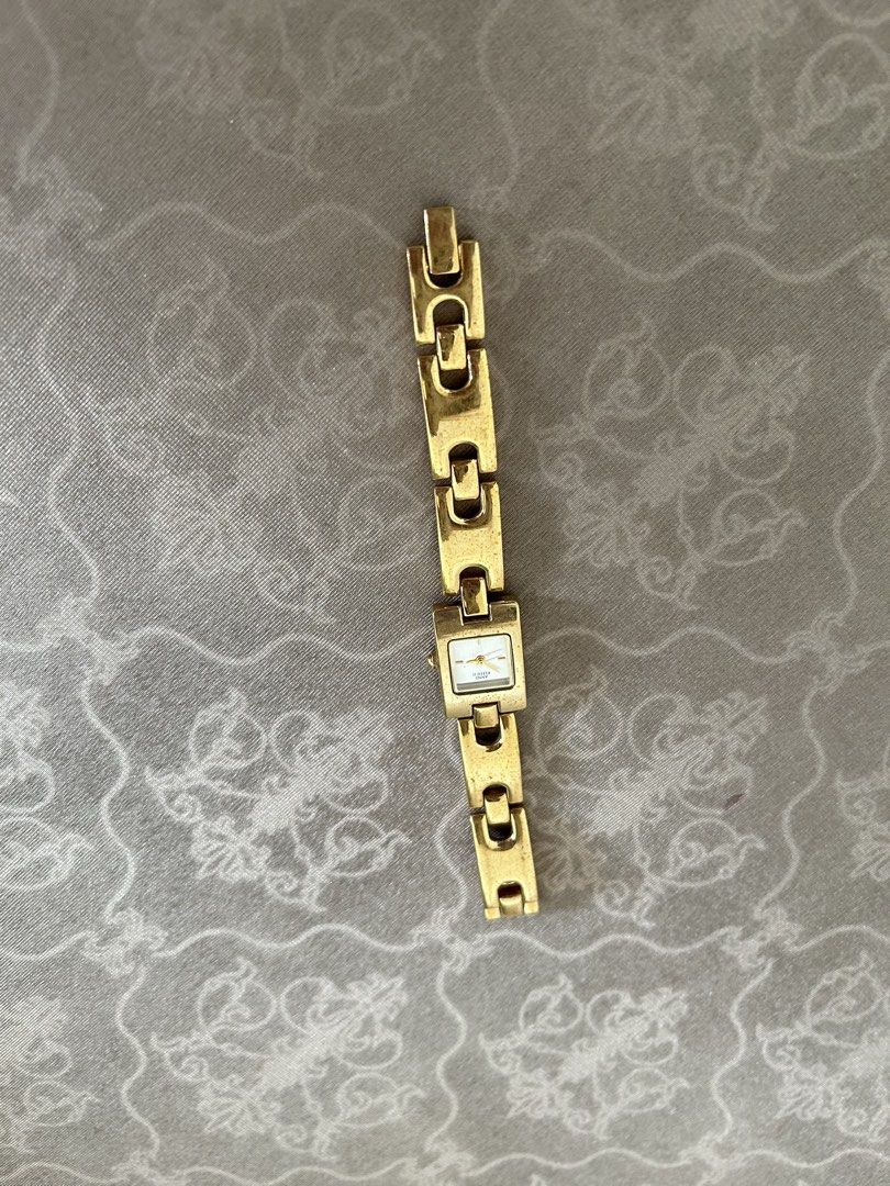 Anne Klein Gold Watch (Category: Women's Watches) located in General Trias. Submitted by pepperreena (Listing ID 1432438107, Image 1). Description: - Anne Klein watch - Gold-toned bracelet - Rectangular face - Stainless steel back -Need to change battery as its not working.