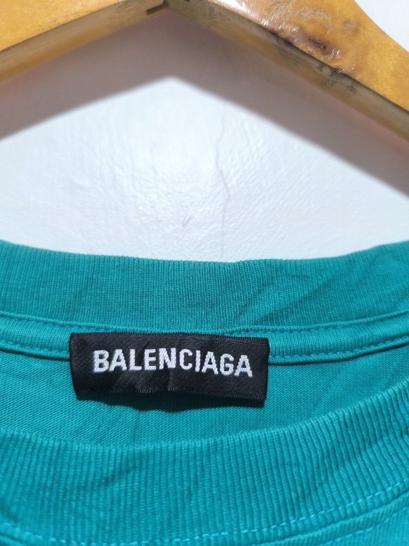 Balenciaga Teal T-shirt (Category: Luxury Apparel) located in Calbayog City. Submitted by phantomthiftstore (Listing ID 1432548520, Image 3). Description: - Authentic Balenciaga t-shirt - Color: Teal - Size: XS - Features Balenciaga logo (front and back) - Made in Portugal - Style: Crew neck, short sleeves.