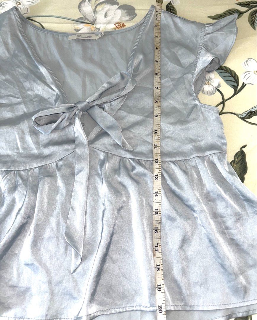 Blue Satin Peplum blouse (Category: Blouses) located in Cavite. Submitted by bbbb444 (Listing ID 1432450261, Image 3). Description: !! NO WW PHOTOS !! - fits M - L - wore once - very loose and is missing a button sa chest part, vv cute nonetheless - thrifted so pls manage ur expectations .