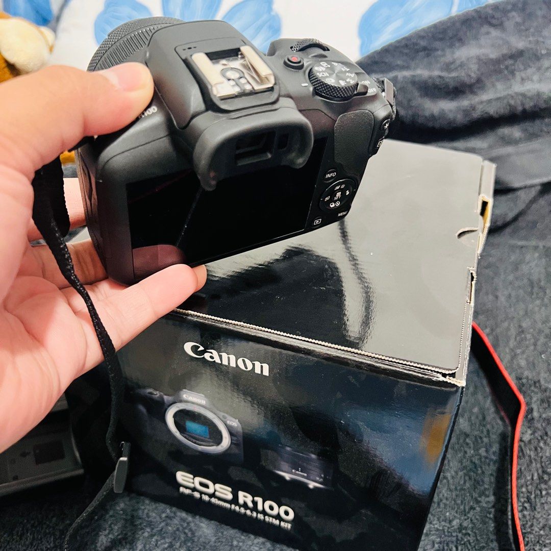 Canon EOS R100 Kit (Category: Cameras) located in Manila. Submitted by boldwolf-cd3679 (Listing ID 1432415705, Image 1). Description: - Canon EOS R100 camera kit - Includes: - Camera body - RF-S 18-45mm f/4.5-6.3 IS STM lens - Charger - Original box - Camera strap - Lens cap included.