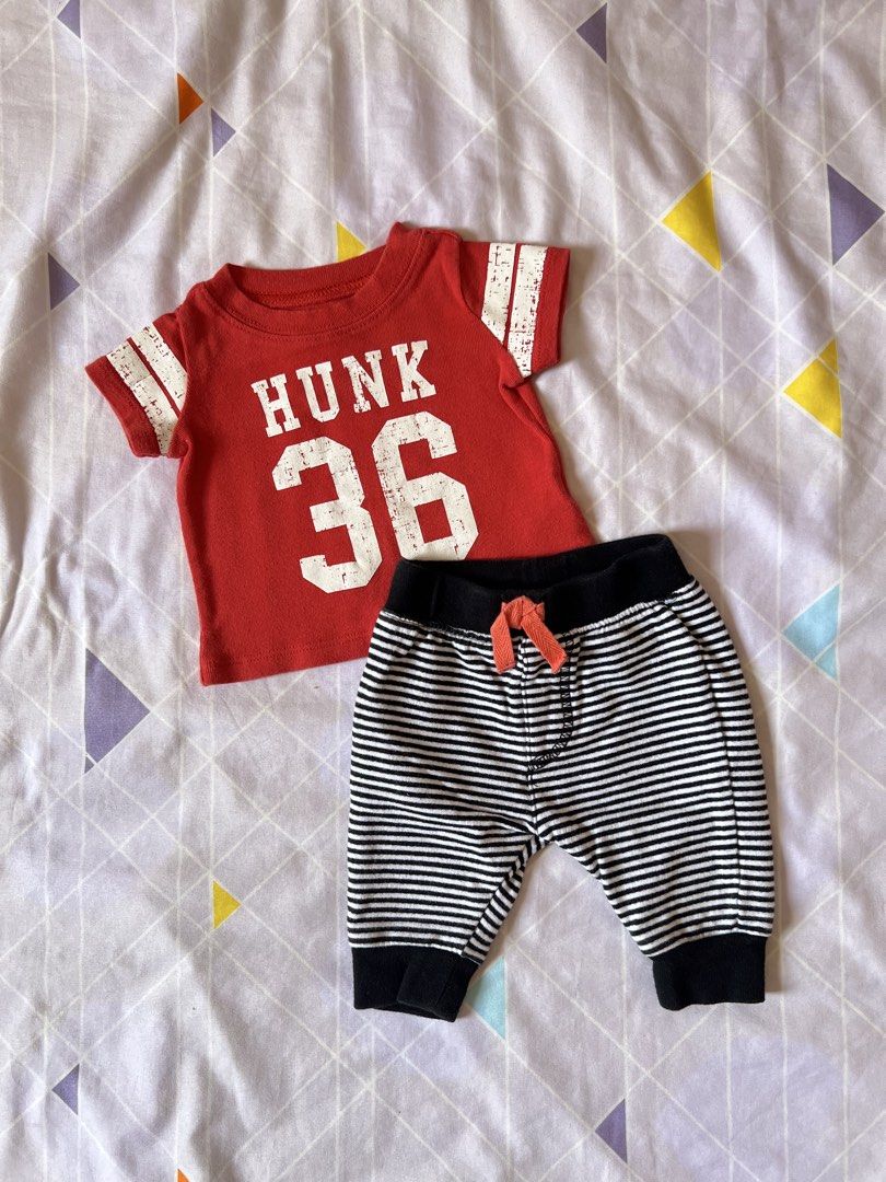 Carter's & Cat & Jack Newborn Outfit (Category: Babies & Kids Fashion) located in Meycauayan. Submitted by maricardima (Listing ID 1432448405, Image 1). Description: - Newborn outfit set - Includes: - Red Carter's t-shirt with "HUNK 36" print and white-striped sleeves - Striped Cat & Jack pants with drawstring and black cuffs - Both items are newborn size 📍Meycauayan, Bulacan 💵 MOP: GCash, BPI ❗️Payment first + SF 🚚 J&T.