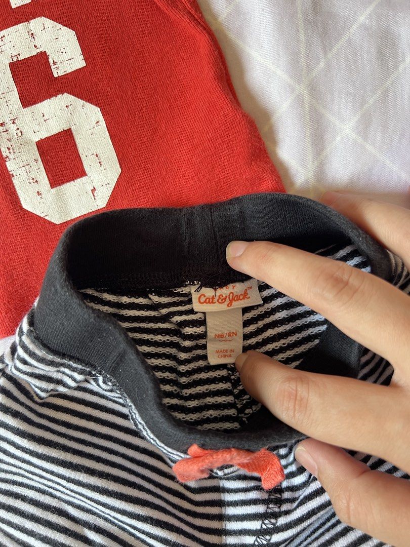 Carter's & Cat & Jack Newborn Outfit (Category: Babies & Kids Fashion) located in Meycauayan. Submitted by maricardima (Listing ID 1432448405, Image 3). Description: - Newborn outfit set - Includes: - Red Carter's t-shirt with "HUNK 36" print and white-striped sleeves - Striped Cat & Jack pants with drawstring and black cuffs - Both items are newborn size 📍Meycauayan, Bulacan 💵 MOP: GCash, BPI ❗️Payment first + SF 🚚 J&T.