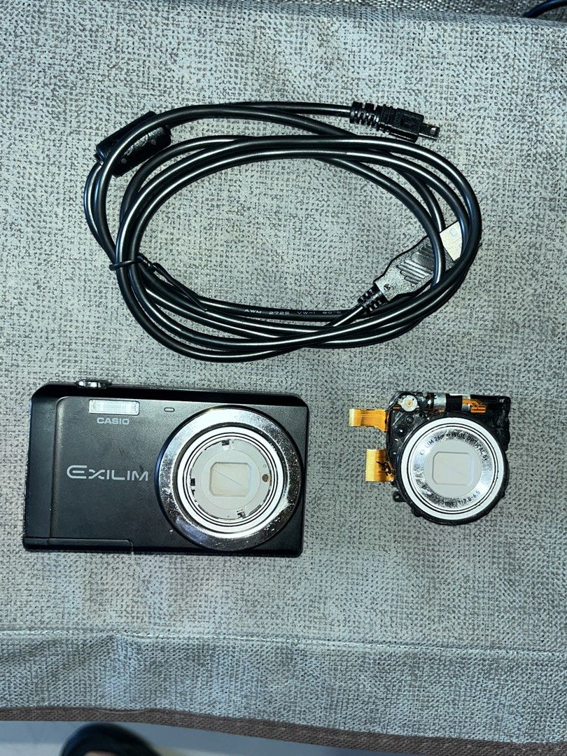 Casio Exilim Digital Camera with Cable (Category: Cameras) located in Manila. Submitted by newbird.936659 (Listing ID 1432483463, Image 2). Description: - Casio Exilim digital camera - Includes camera body and lens - Comes with a charging cable - Model name is visible Cons: Cam lens error, Haven’t repaired it but it will have the other lens with. .