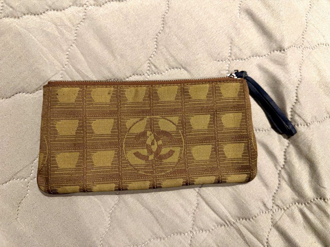 Chanel New Travel Line Coco Mark Pouch (Category: Luxury Bags & Wallets) located in Manila. Submitted by tatabesoriginals0414 (Listing ID 1432545928, Image 2). Description: In good condition. Zipper puller has been replaced with original leather from Balenciaga City..