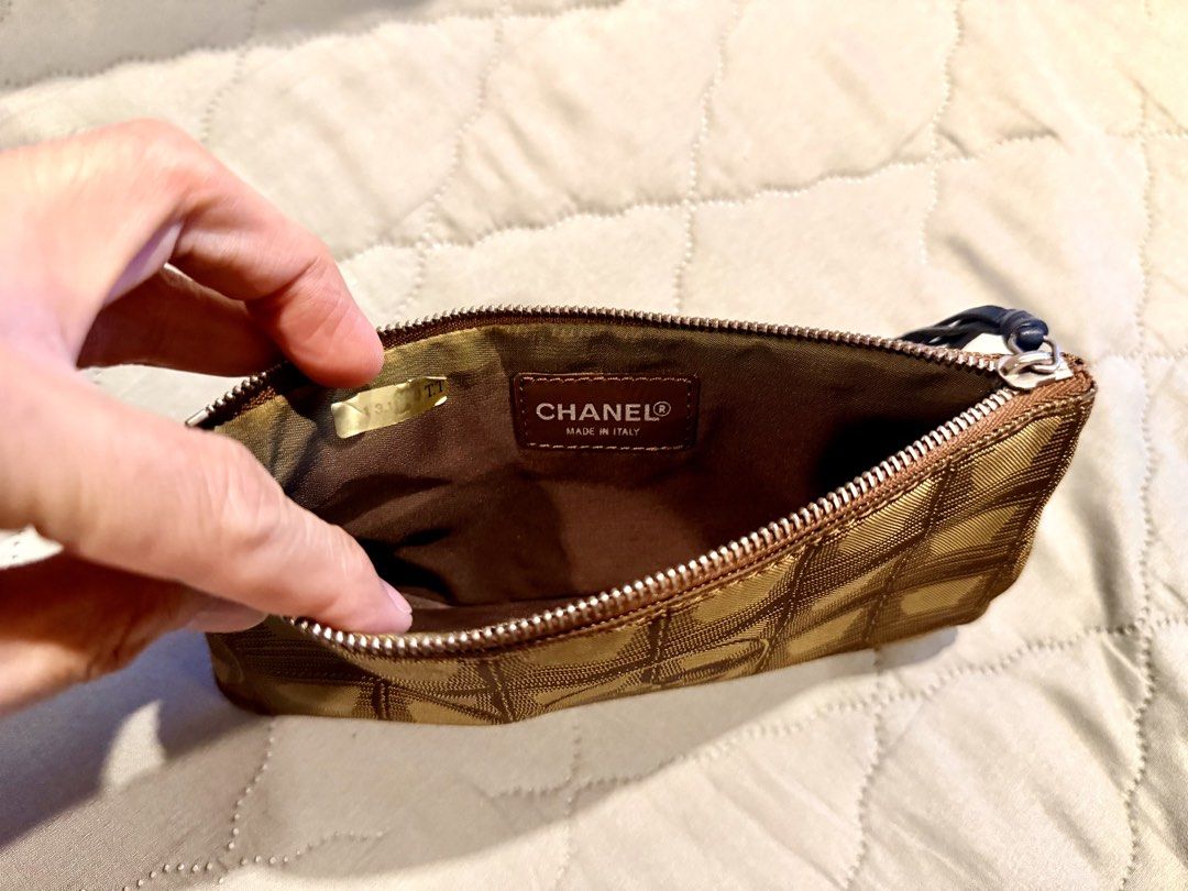 Chanel New Travel Line Coco Mark Pouch (Category: Luxury Bags & Wallets) located in Manila. Submitted by tatabesoriginals0414 (Listing ID 1432545928, Image 3). Description: In good condition. Zipper puller has been replaced with original leather from Balenciaga City..