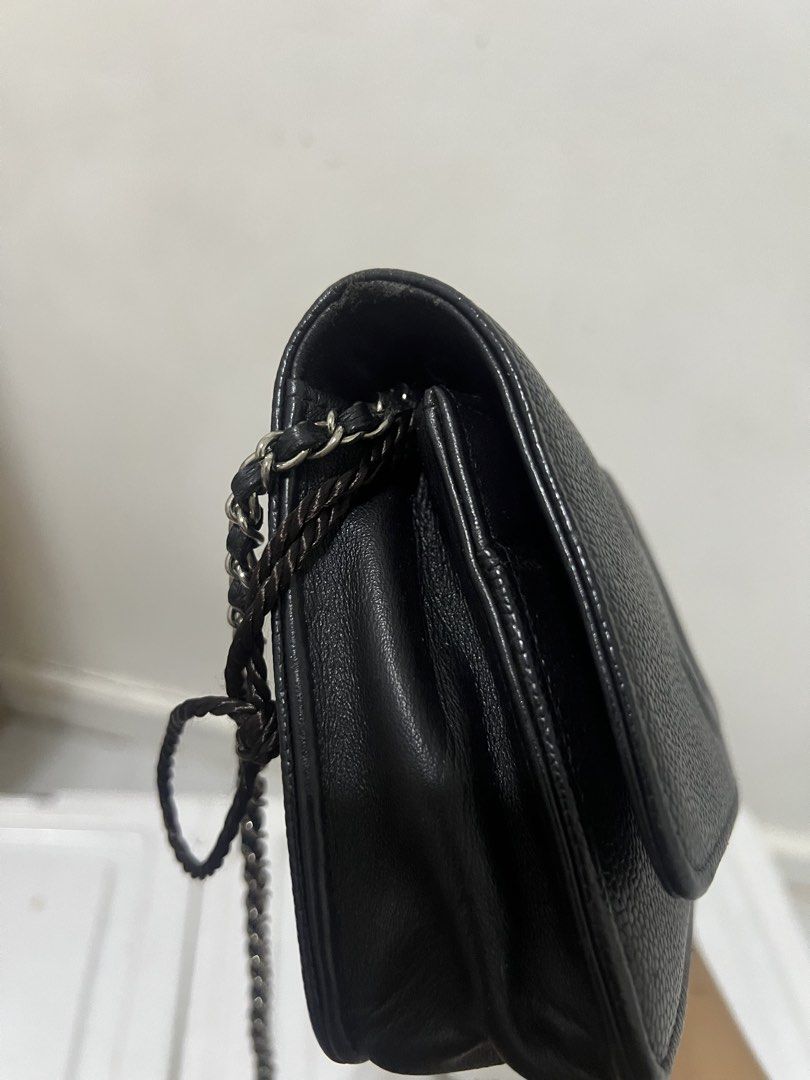 Chanel WOC Black Caviar Leather (Category: Luxury Bags & Wallets) located in Makati City. Submitted by myleen0411 (Listing ID 1432588267, Image 3). Description: - Authentic Chanel Wallet on Chain (WOC) - Black quilted caviar leather - Features the iconic interlocking CC logo - Includes a chain strap - Interior with multiple compartments and card slots.