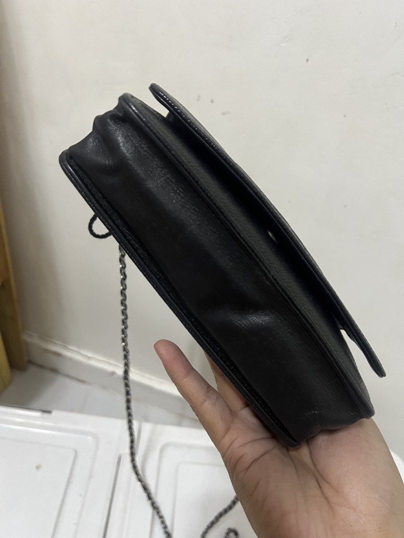 Chanel WOC Black Caviar Leather (Category: Luxury Bags & Wallets) located in Makati City. Submitted by myleen0411 (Listing ID 1432588267, Image 2). Description: - Authentic Chanel Wallet on Chain (WOC) - Black quilted caviar leather - Features the iconic interlocking CC logo - Includes a chain strap - Interior with multiple compartments and card slots.