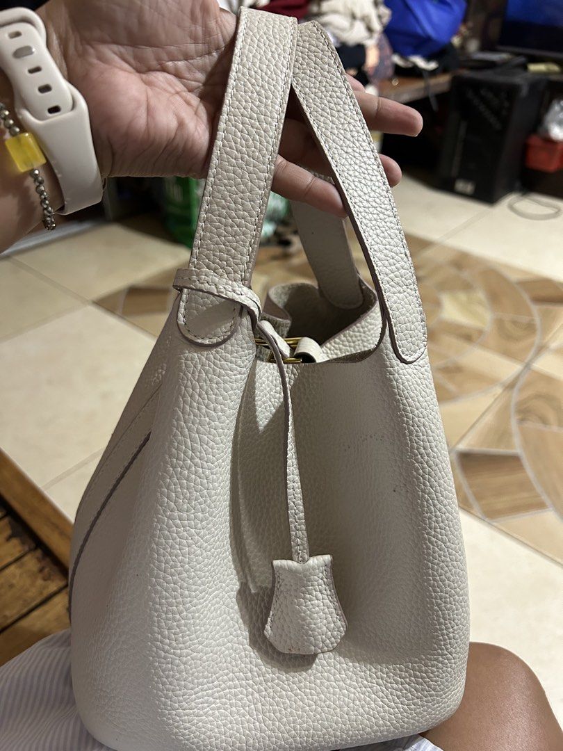 Cream-colored Picotin style (Category: Luxury Bags & Wallets) located in Cebu City. Submitted by yenetcuba52435 (Listing ID 1432540189, Image 1). Description: - Cream-colored Picotin style bag - Bucket bag design - Made of leather - Pristine condition - Stylish and functional.