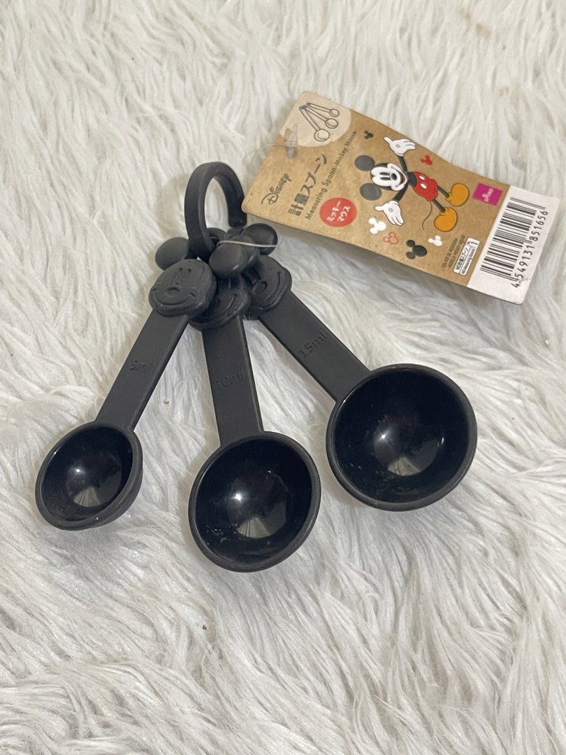 Disney Mickey Mouse Measuring Spoons (Category: Bakeware) located in Bayambang. Submitted by foursiblings081228 (Listing ID 1432425309, Image 1). Description: Set of three black measuring spoons featuring Mickey Mouse design. Includes 5ml, 15ml, and 19ml spoons. Comes with a ring to keep the spoons together. The original tag is still attached..