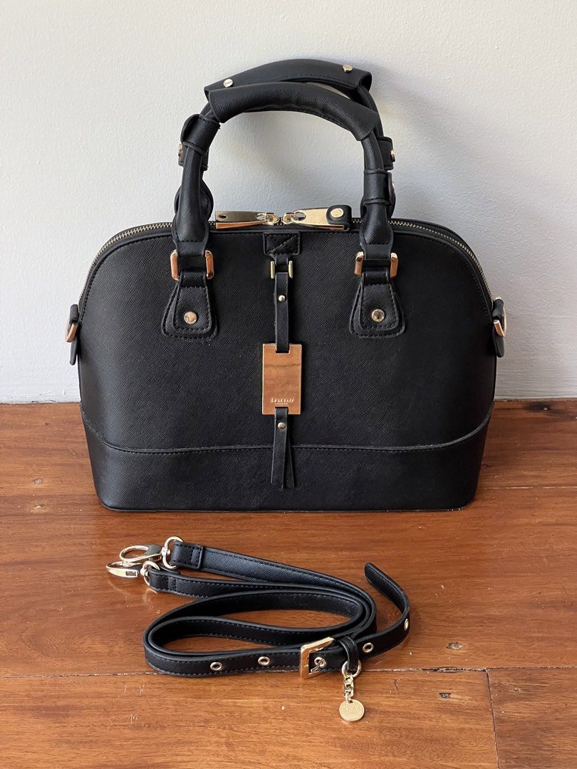 Dune London Black Dome Handbag (Category: Luxury Bags & Wallets) located in Quezon City. Submitted by pcera (Listing ID 1432465616, Image 2). Description: - Flaws: peeled off glazing on the bottom, detached accent on one of the zipper pulls.