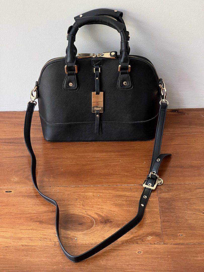 Dune London Black Dome Handbag (Category: Luxury Bags & Wallets) located in Quezon City. Submitted by pcera (Listing ID 1432465616, Image 1). Description: - Flaws: peeled off glazing on the bottom, detached accent on one of the zipper pulls.