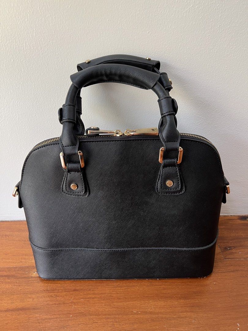 Dune London Black Dome Handbag (Category: Luxury Bags & Wallets) located in Quezon City. Submitted by pcera (Listing ID 1432465616, Image 3). Description: - Flaws: peeled off glazing on the bottom, detached accent on one of the zipper pulls.