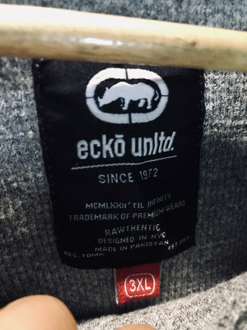 Ecko Unltd. Long Sleeve Shirt 3XL (Category: Tshirts & Polo Shirts ) located in Manila. Submitted by zerimar01 (Listing ID 1432591239, Image 2). Description: - Ecko Unltd. long sleeve shirt - Color: Gray - Size: 3XL -25x30 - Features Ecko logo on front and sleeve - Features Rhino Brand logo on sleeve - Ribbed texture - Made in Pakistan.
